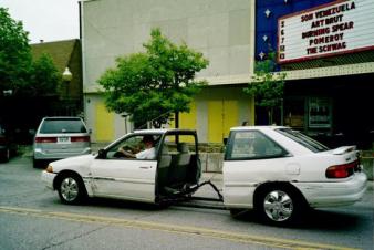 This drives like an accordian. ~  Car parade, Lawrence, Kansas. 