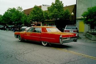 Red velvet caddy. ~  Car parade, Lawrence, Kansas 