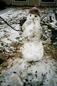 I'm melting ~  A sad snowman in Lawrence, Kansas. 2007 