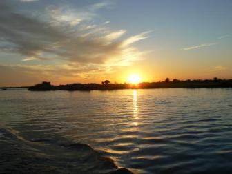 Thebe River ~   Our first night as a group watching the sun set on the Thebe River in Botswana. 