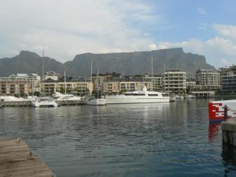 Table Mountain ~  From the V&A Waterfront looking back towards the majestic Table Mountain. I put an offer on that yacht. Apparently half a bag of chips wasn't enough. 
