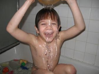 I love water! ~ This is what you get when you have a Pisces named Jonah.  He dumps bucket after bucket of water on himself, shrieking with laughter.  Age 6.