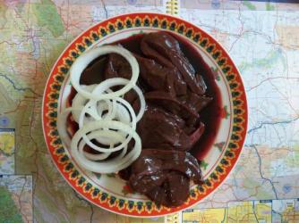 Bloody buffalo liver and onions... ~  ...on a map of Montana. And yes, I cooked it all before eating. *Delight* 