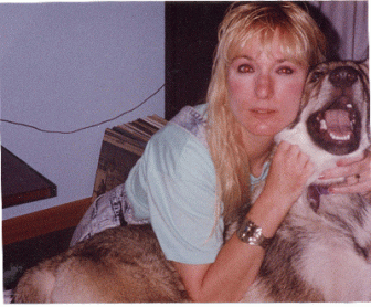 Me and my Wolf, Kody ~  Kody, my Canadian Tundra Wolf from Kodiak, Canada, that used to own me.  Kody was about four years old here.  I'm not telling you how old I was in this picture, LOL  I don't know why my blue eyes always turn out Red in camera shots.  No wonder I'm not photogenic, the devil-woman comes out of me.... 