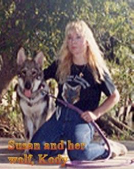 Another pic of Me and my Wolf Kody ~  Picture of me in happier days, when I was owned by this Tundra Wolf Hybrid, Kody.  We were on the dock of the Tangipahoa River in Ponchatoula, Louisiana, where my family had a beautiful summer home for thirty years, outside of New Orleans.  Many poems I wrote about that River and my wolf.  I miss you madly, Kody! 