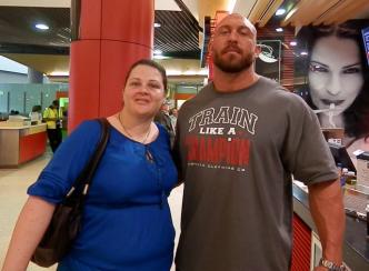 Me with Ryback!! (and the lady in the noodle ad) ~ Didn't even see Ryback until Bella pointed him out asking if he was 'one of those wrestlers' and I looked over and he was on the other side of the counter to me. Yeah, I'm observant *Rolleyes* Hey, I was tired!

Told him I loved his table match, then we went to find something to eat as security still looked intimidating to Bella. While deciding on noodles or Subway and I saw him again at the noodle shop and thought to ask for a photo but saw him shoot down some guy who approached him so I decided against it and ordered my Subway.

While Bella was waiting to order noodles we saw him pose with a kid, so I thought I'd try my luck.

Fe...