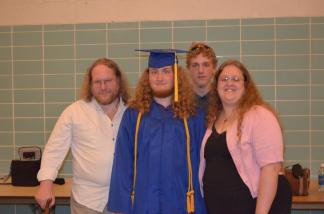 Rowland with family @ Graduation 29 May 2011 ~  That's my ugly mug on the left there, my two sons in the middle, and the love of my life, Cassie, on the right. 
