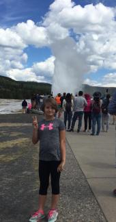 Hailey at Old Faithful ~ Old Faithful blows of her steam and Hailey gets in on the view. ~ Day 2