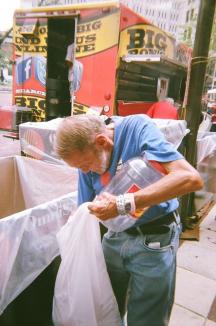 Dropping Tabs Into Bin ~  This was taken on July 17, 2015 of Larry dropping pop can tabs into one of the huge bins at that year's Ronald McDonald House pop-tab and coin drop. 
