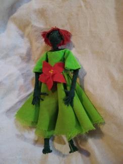 Poinsettia ~ Originally Poinsettia was an attempt at remaking Rose. But she didn't quite match up with earlier versions of Rose. So she got a new dress and a new name. 