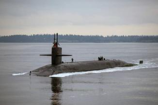 A Trident Submarine Cruising on Hood Canal, Washington ~ I would most likely be in the Engineroom which is behind the men clustered around the hatch on the right side of the photol