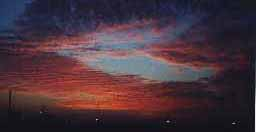 The clouds expand, over the parched land, over the desert and the sea