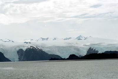 Three glaciers fill the sky ten miles away