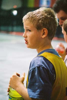 Colby gets a short rest during a basketball game.