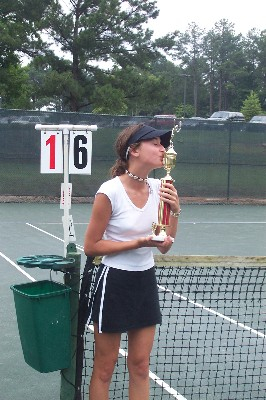 Laney winning her tennis tournament.