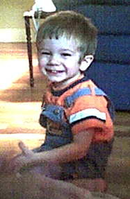 My two-year-old son Jonah, smiling big.