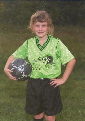 Tiffany, now 8, in this fall's soccer uniform.