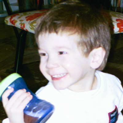 Jonah, on his third birthday, smiling big!