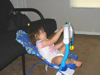 When her brother came Emma just had to try outher old chair