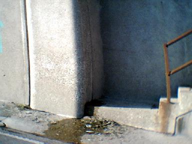 The bottom landing of one of the concrete staircases 