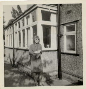 Standing outside John's home. 1964
