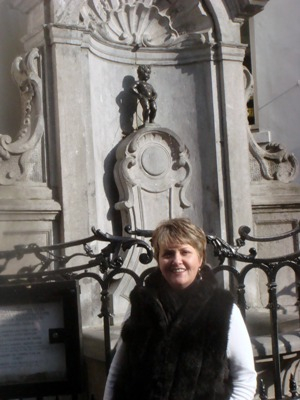 Me in front of Mannekin Pis statue in Brussels