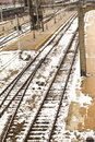 Desolate snow-covered tracks at a train station in the 1940's.