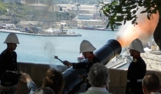 The firing of the noon-day gun at Barrakka Gardens, Valletta