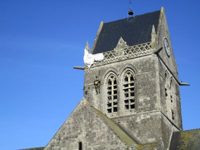 Airborne soldier hanging from church