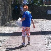 Walking down the street in Savannah's shopping district for tourists.