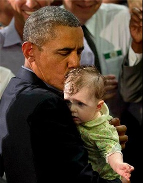President Obama kissing a baby in Buffalo.
