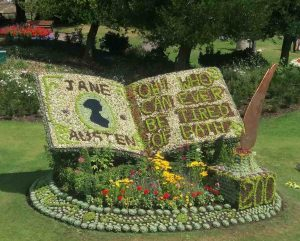 Beautiful lawn image of Jane Austen and her book with flowers and a silhouette.