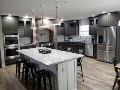 A gray painted kitchen with Island