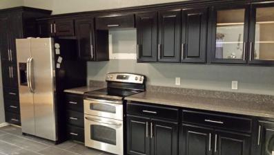 A black painted kitchen.