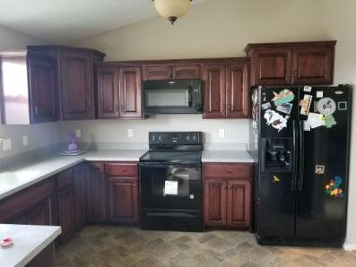 A stained Maple kitchen.