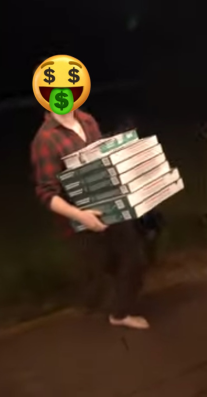 A boy struggling to bring in a dozen boxes of pizza!