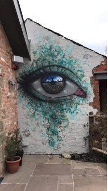 A mural of a staring eye.