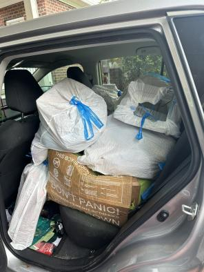 A sibling's car which is full of trash.