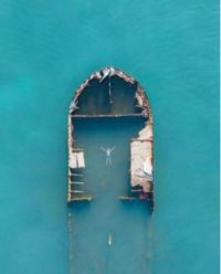 The bones of a wrecked ship, swimmer inside.