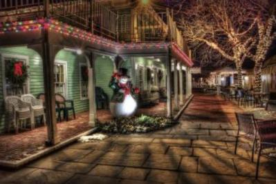 A snowman on a southern veranda.