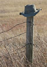 Cowboy Hat on Fence Post