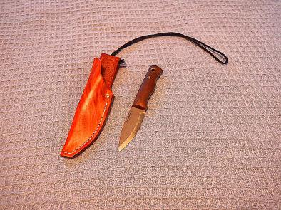 A utility/camp knife worn around the neck instead of on the belt.