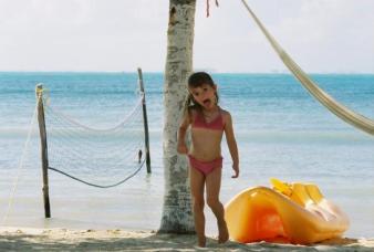 Isla Mujeres ~ Lindsay will barely let me take a picture without sticking out her tongue and acting weird. Here we are on the island, Isla Mujeres. She managed to get sand everywhere this day...