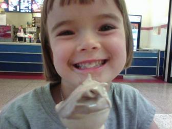 Ears Pierced, eating ice cream ~ The ice cream really helped her to feel better!