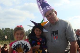 Granddad, Olivia and Aiden ~ It's like this... Olivia didn't want to wear her princess hat, but she did want my fan.  Aiden is showing off his dragon hat. Granddad, always the good sport, got the princess hat.
I love my husband!