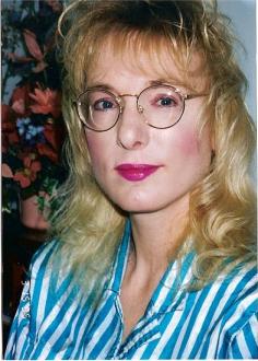 Me with Glasses and Short Hair ~  This was taken several years ago when I got fitted for my new John Lennon Glasses and got a hair trim.  I wanted to see what it felt like to have short hair.  I wore Contact Lenses for over 15 years but developed allergies so bad, I had to resort to glasses, unfortunately.  Since this was taken, I've also let my hair grow back longer.  I never did like short hair on me. 