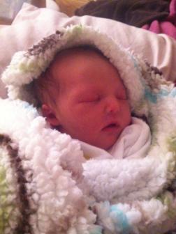 10-24-2012 ~  Best birthday prezzie for Mommy, ever! Bundled up in her first blanket, all cozy and warm. 