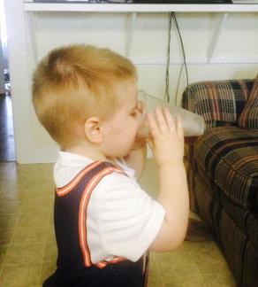 Kaden drinking from a big-boy cup ~  No description included. 