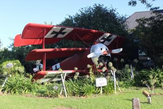WWI Tri-Plane Replica ~ I love dining at these restaurants.  Their names vary, but all are based on WWI air squadrons and the like.  This is the 94th Aerosquadron at the Montgomery Air Field near San Diego.  The food is terrific, though it is a little pricey.  Each is located near a small airport in a large city.  I enjoy the atmosphere and such. If you sit a certain tables, you can listen to the tower and planes transmissions.